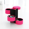 Three Layer Multi Tiered Circular Storage Columns Unrolled Vertically Showcasing Soft Black Velvet Interior Lined with Luxury Jewelry