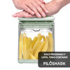 Ergonomic top-press mechanism demonstration showcasing smooth heavy-duty manual leverage action to slice raw whole potatoes effortlessly inside the heavy-duty clear acrylic catch container by Zalviro Click.