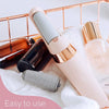 Portable Pedicure File Device Displayed on Luxury Spa Vanity Counter with Glass Essential Oil Bottles