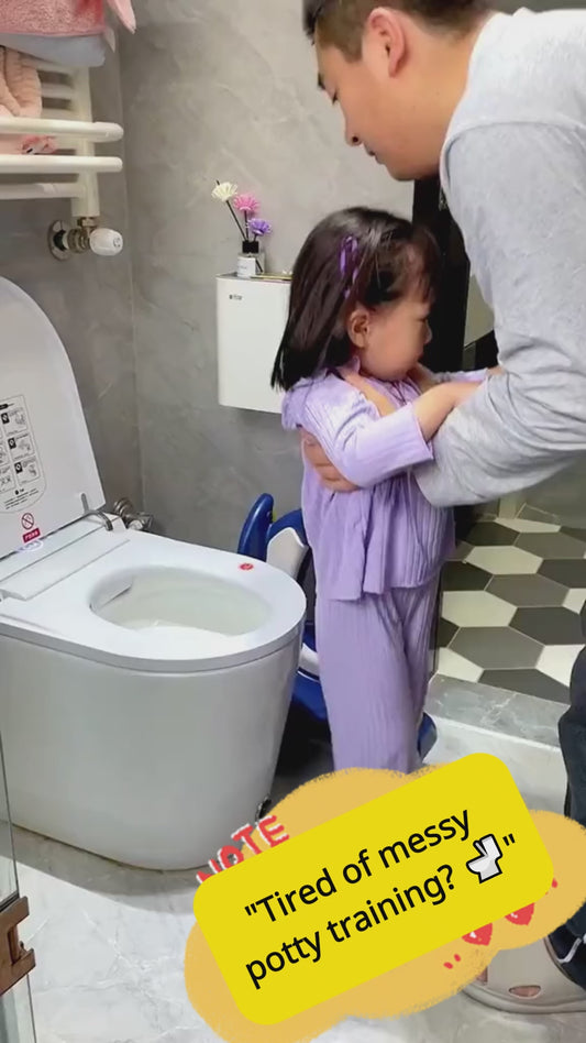 "A father helping a young toddler girl in the bathroom with a children potty training toilet seat ladder."